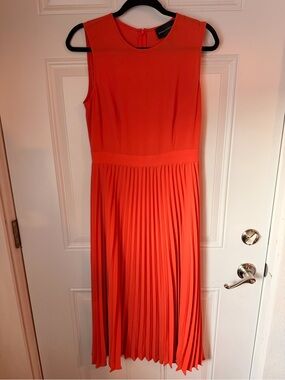 Donna Morgan Sleeveless Pleated Midi Dress in Coral-Red